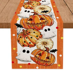 Halloween table runner with cute ghost and pumpkin print for festive dining table decoration.