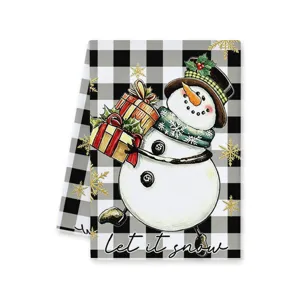 Black and white buffalo check Christmas kitchen towel featuring cute cartoon snowman and gifts.