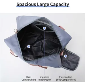 Detail view of large capacity travel duffel bag with independent shoe compartment and pockets.