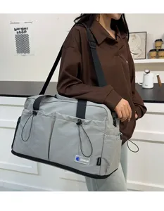Large capacity travel duffel bag stylish grey shoulder gym bag for women daily outdoor use.