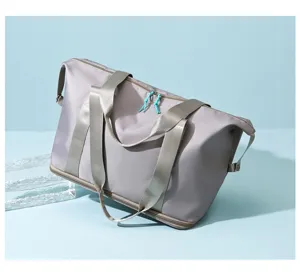 Solid color gym duffel bag with wet dry separation and expansion, perfect for travel.