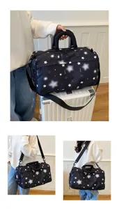 Black star print travel duffel bag detail, large capacity gym sports bag with comfortable straps.