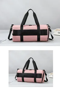 Pink fitness gym bag detail, waterproof travel duffel with shoulder strap and dual zippers.