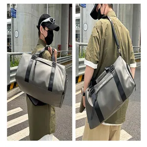 Large capacity gym duffel bag with wet dry compartment for travel fitness sports workout.