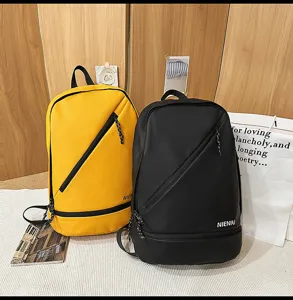 Detailed view of casual travel backpacks in yellow and black with diagonal zipper design.