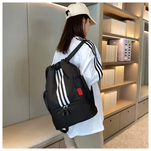 Black drawstring backpack with white stripes, large capacity sports bag for daily use.