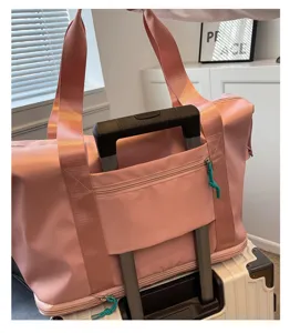 Pink travel duffel bag with luggage sleeve and waterproof oxford fabric for fitness.