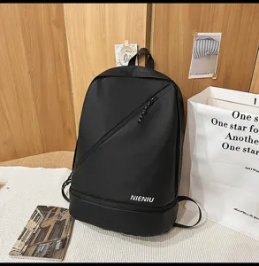Black waterproof backpack with diagonal zipper, durable fabric, and spacious compartment.