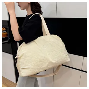 Large capacity travel duffel bag for women, casual waterproof gym sports shoulder tote.