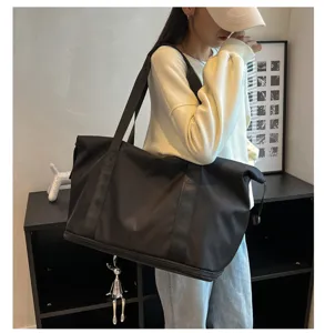 Black oxford travel duffel bag with large capacity, gym bag with handle and wet dry separation.