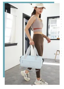 Light blue nylon sports gym bag with large capacity, ideal for fitness and short travel.