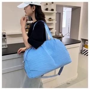 Large capacity travel duffel bag in light blue, perfect for short trips and gym fitness.
