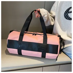 Pink sports duffel bag detail, large capacity waterproof travel gym bag with black handles.