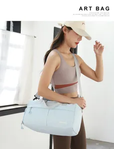 Light blue nylon sports gym duffel bag for women, large capacity travel bag with shoulder strap.