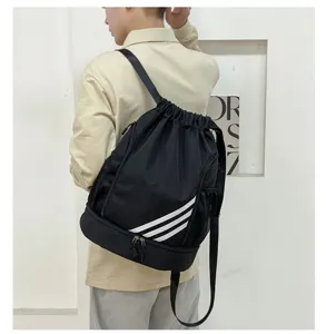 Black drawstring sports backpack with separate shoe compartment and stylish athletic stripes.