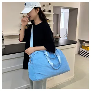 Large capacity travel duffel bag for women, lightweight waterproof gym sports shoulder bag.