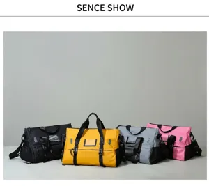 Detail view showing multi-color travel sports duffel bags in a neat studio setting.