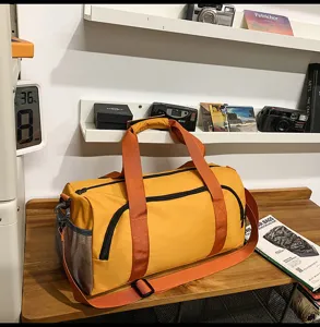 Large capacity yellow travel duffel bag for fitness sports and gym use with shoulder strap.