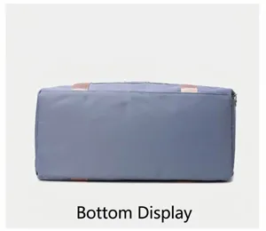 Detailed view of the large capacity travel duffel bag bottom design in grey blue color.