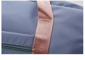 Durable travel bag detail showing reinforced stitching handles and smooth zipper for daily gym use.