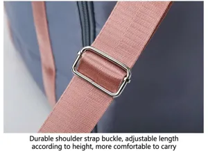 Travel bag shoulder strap metal adjustable buckle detail close-up, durable and sturdy design.