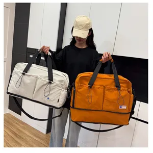 Large capacity travel duffel bag with shoulder strap, perfect for gym, yoga and daily use.