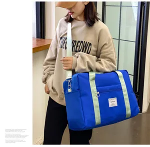Large capacity travel duffel bag for women, waterproof gym bag with shoe compartment.