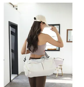 Detail view of lightweight nylon gym bag with dry wet separation and shoulder strap.
