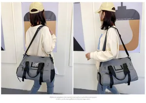 Large capacity grey gym travel bag with wet dry separation and adjustable shoulder strap.