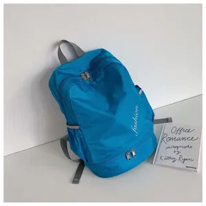 Blue nylon sports backpack with wet dry separation and comfortable straps for travel and gym.