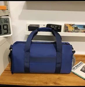 Large capacity blue travel duffel bag with wet dry separation and durable sports gym design.