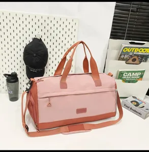 Large capacity travel duffel bag with pink and orange color block design for fitness and sports.