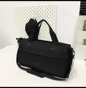 Large capacity black travel duffel bag for sports fitness and weekend trips detail view.