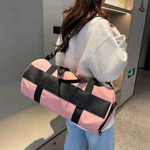 Large capacity pink fitness duffel bag for women and men, lightweight travel sports bag.