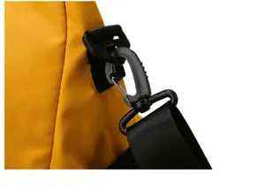 Close-up detail of the durable shoulder strap hook and waterproof yellow fabric on the bag.