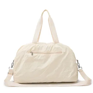 Casual beige nylon travel duffel bag with shoulder strap and large capacity for daily gym.
