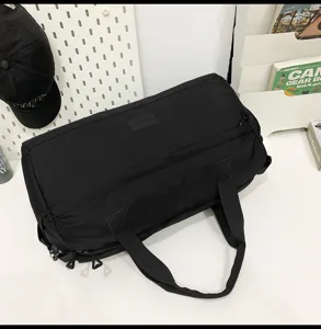 Large capacity travel duffel bag for fitness, sports, and business trips with wet dry separation.
