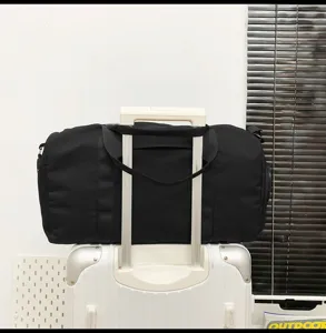 Large capacity travel duffel bag for sports, fitness and business trips, black color.