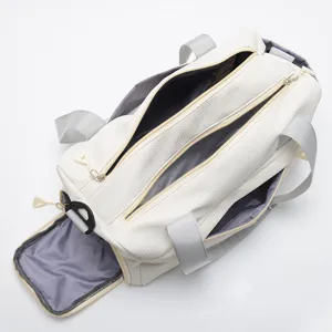 White nylon sports duffel bag top view, large capacity gym travel bag with multi pockets.