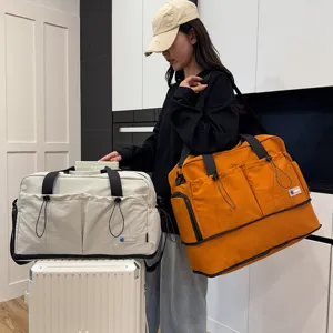 Large capacity travel duffel bag women multi-purpose shoulder handbag for gym and fitness.