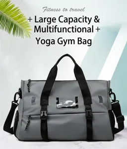 Gray fitness duffel bag detail showing durable waterproof fabric, sturdy handles and front buckles.