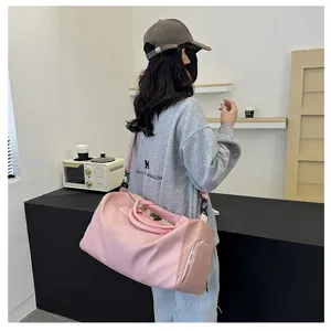 Large capacity pink travel duffel bag for gym, fitness, and short business trips with shoulder strap.