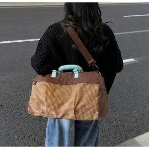 Large capacity travel duffel bag with wet dry compartment and stylish grid design for sports.