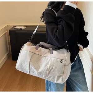 Large capacity fitness duffel bag with stylish grid pattern, perfect for travel and sports.
