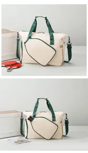 Vue détaillée du grand sac de sport avec poche pour raquette et sangles vertes solides.