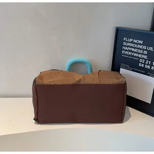 Fashionable large capacity fitness bag with grid flap and blue handle for outdoor travel detail view