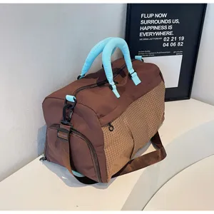 Large capacity travel duffel bag for women and men, stylish fitness gym bag with wet dry compartment.
