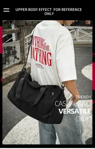 Detail shot showing the comfortable upper body wear effect of the large capacity black gym duffel bag.