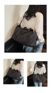 Large capacity black travel duffel bag for gym, yoga, and outdoor sports. Durable nylon.