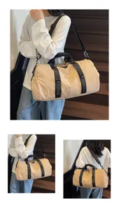 Casual travel duffle bag detail view, showing versatile waterproof fabric and sturdy shoulder straps.